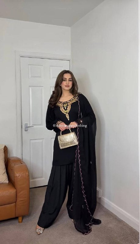 "Graceful Glamour: Timeless Ethnic Elegance in Pastel and Black Hues"