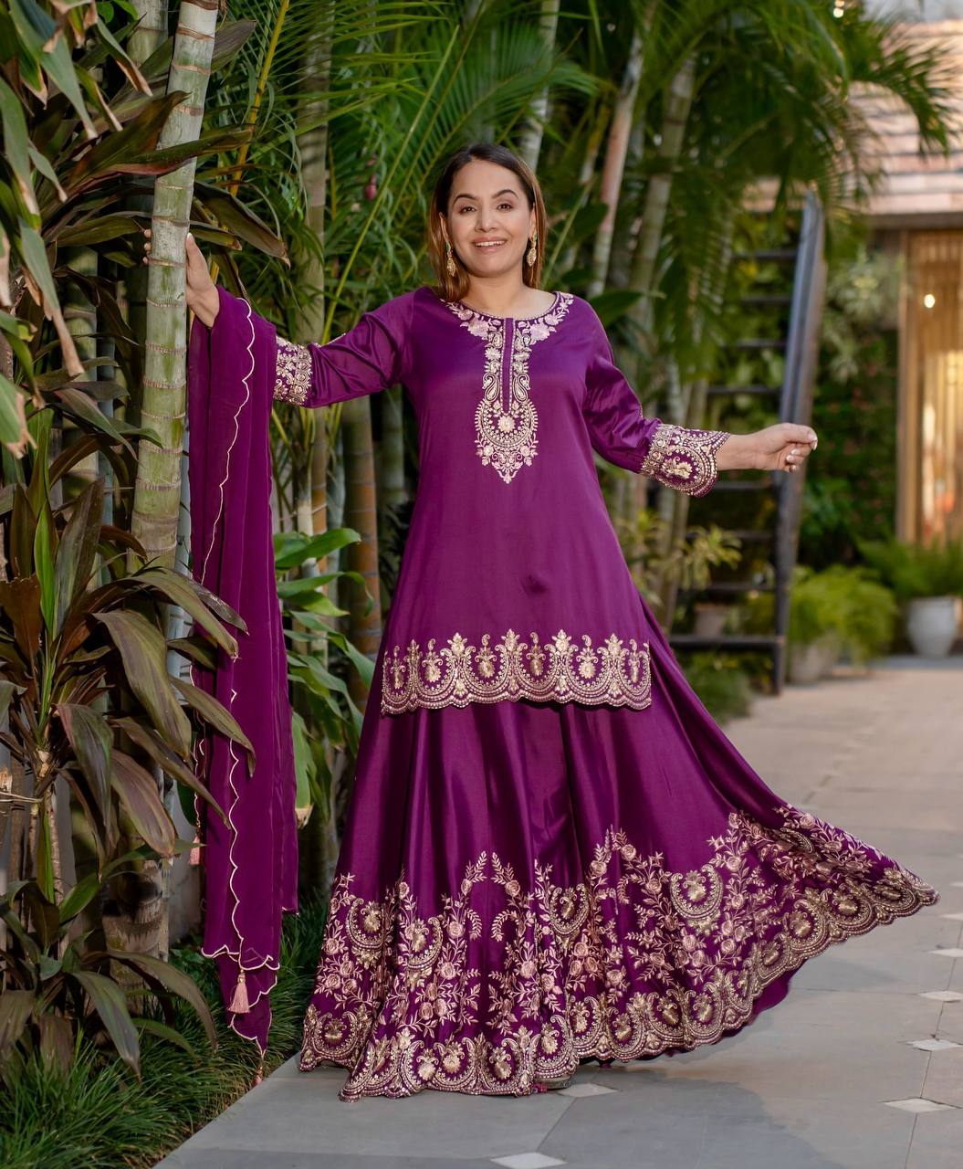 Radiant Heritage: Two Women Embodying Cultural Splendor in a Majestic Indian Courtyard