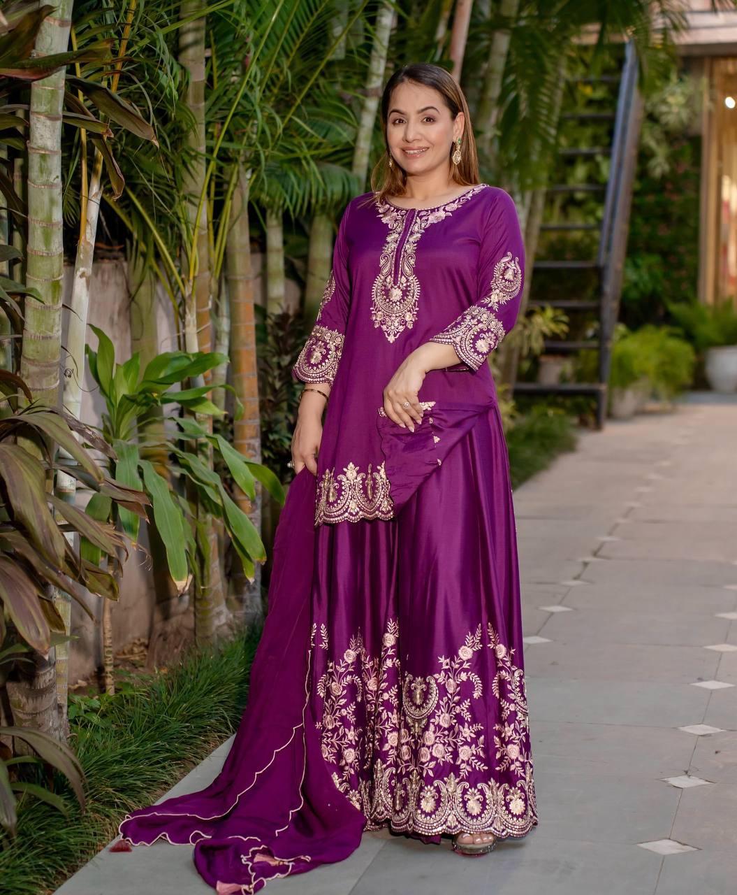 Radiant Heritage: Two Women Embodying Cultural Splendor in a Majestic Indian Courtyard