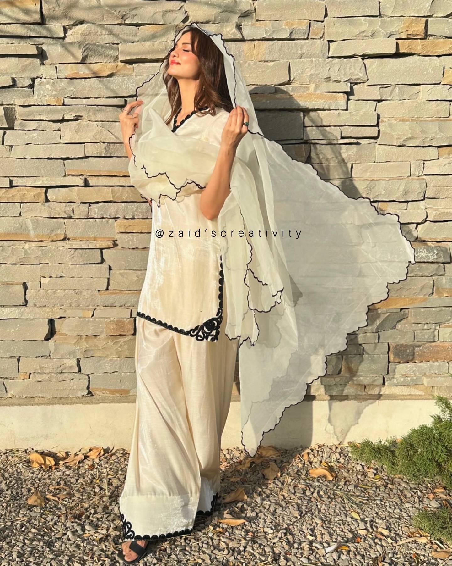The Essence of Sophistication: A Woman in a Striking White Suit Portrait