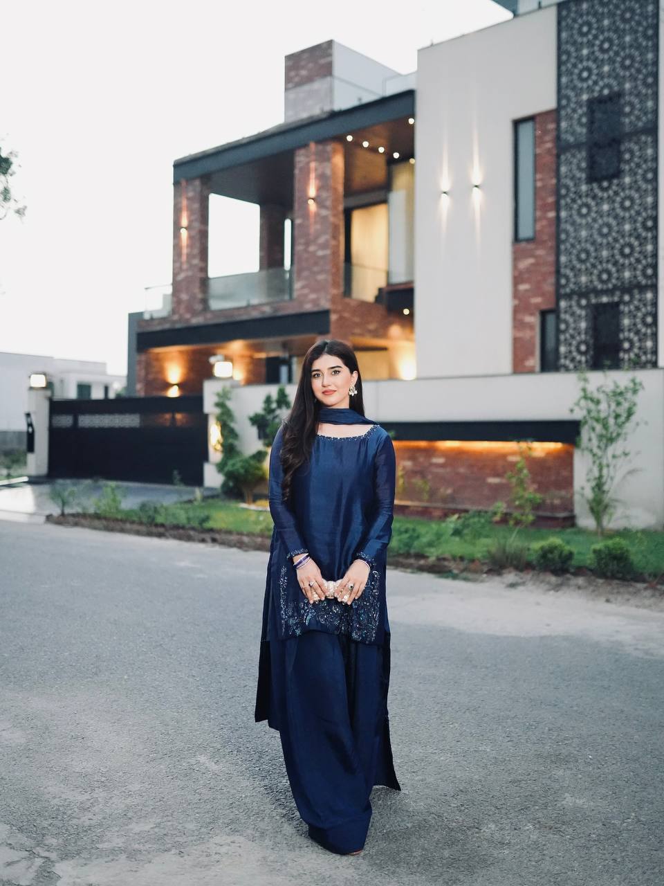 Elegant Harmony: The Blue Suited Muse Embracing Nature's Serenity in a Chic Urban Oasis