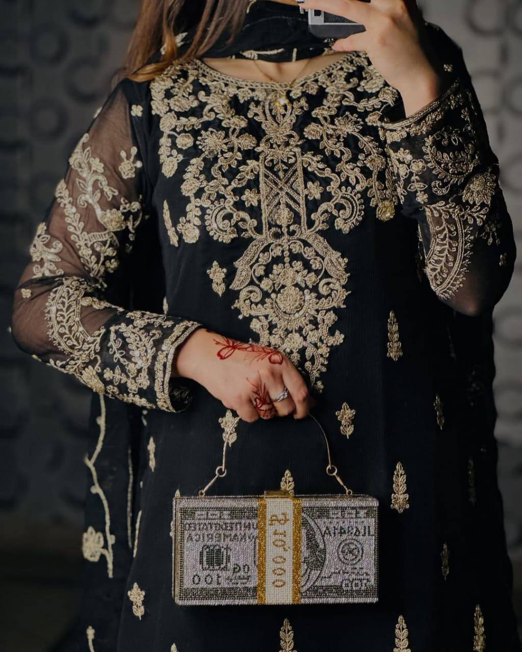 Sophisticated Selfie: A Woman's Poise in Elegant Black Ensemble